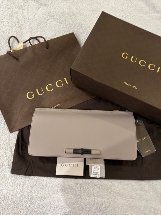Gucci Handbags - Gucci Cream Leather Clutch Bag with Black Bamboo Accent Authentic